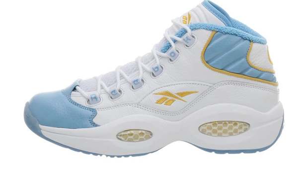 White and blue Reebok shoe.
